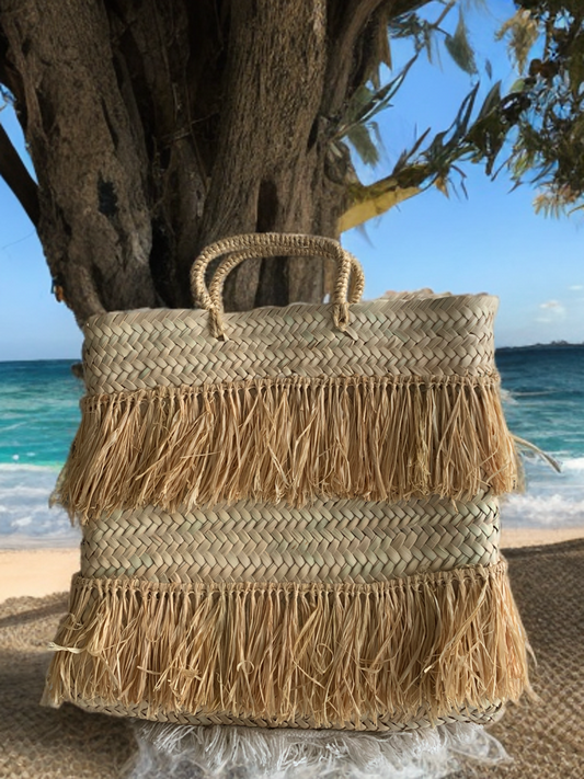 Bolso de mano  fleco natural.